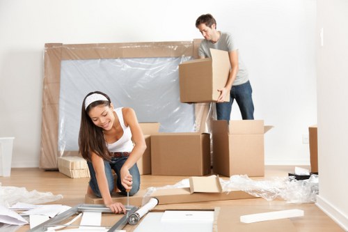 Professional flat removals in Stokenewington with moving van and packed boxes